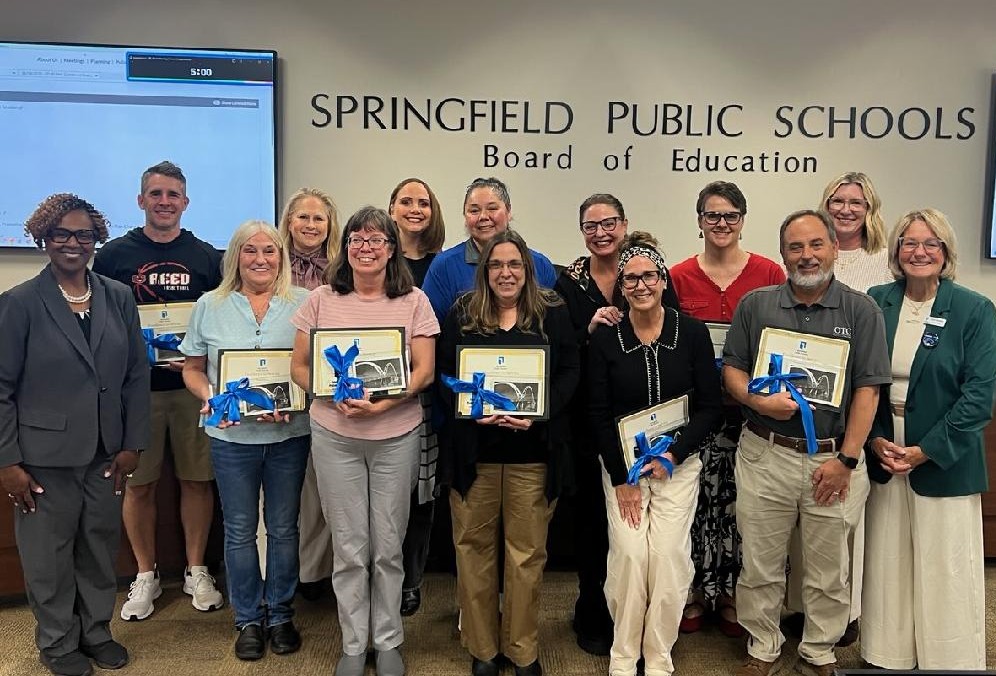 Congrats to Dr. Rhodes and Coach Smith for being recognized for 25 years of service with @officialsps. They were recognized along with other dedicated educators at last night's Board of Education meeting.