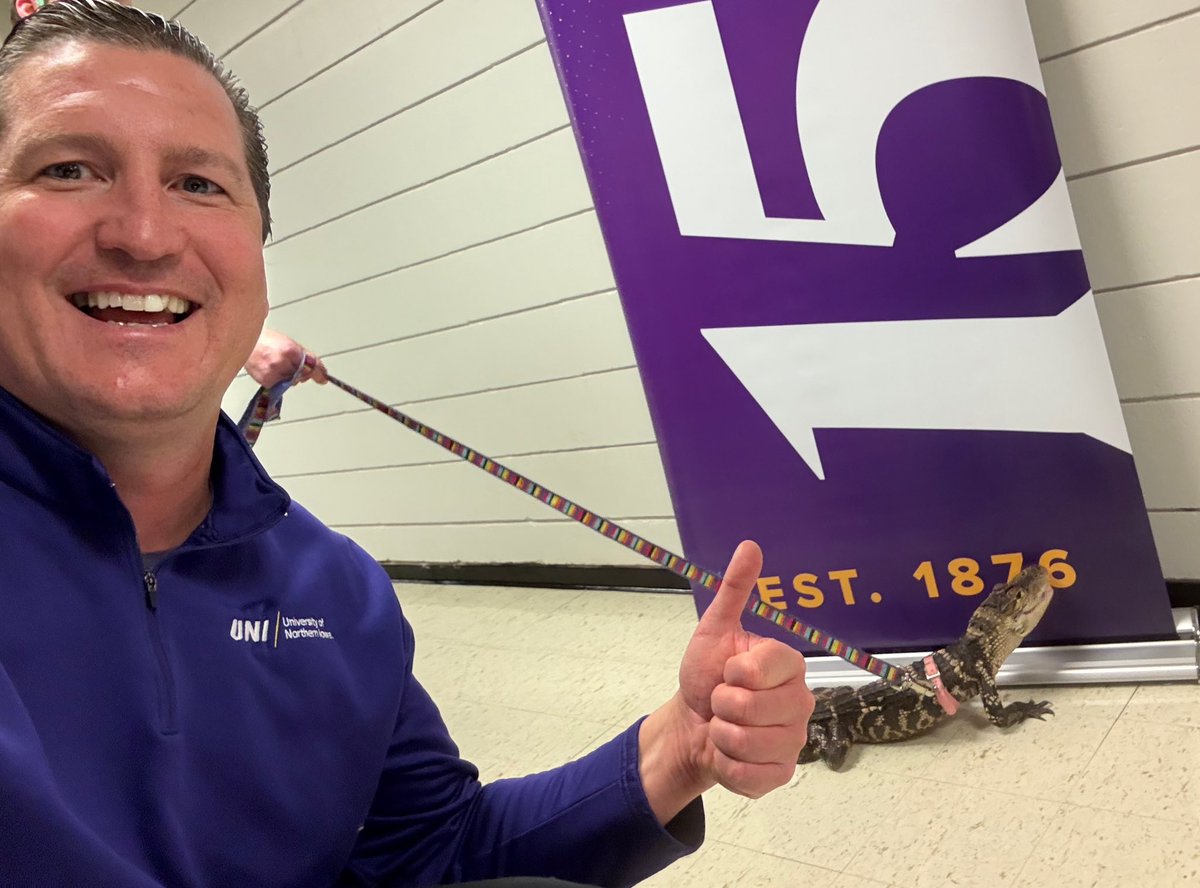 PeteMoris's tweet photo. Another historic day at UNI 🐊

President Mark Nook &amp; I helped walk Wally the Gator to his new campus habitat!

#UNI150 💜💛 https://t.co/W1Lqkn4Dfy