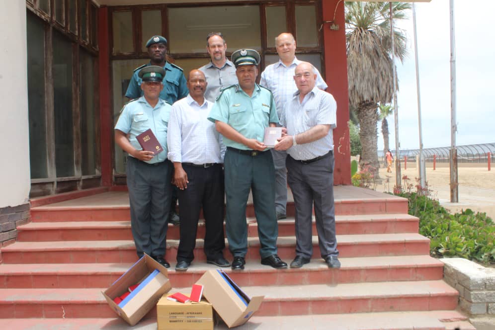 Walvis Bay- Community Advisory Committee member Ivo De Gouvia, together with the Gideons International Church donated 200 bibles offering spiritual support to inmates. 

The Bibles are in English, oshindonga, and Afrikaans, symbolizing hope, guidance, and the power of faith.