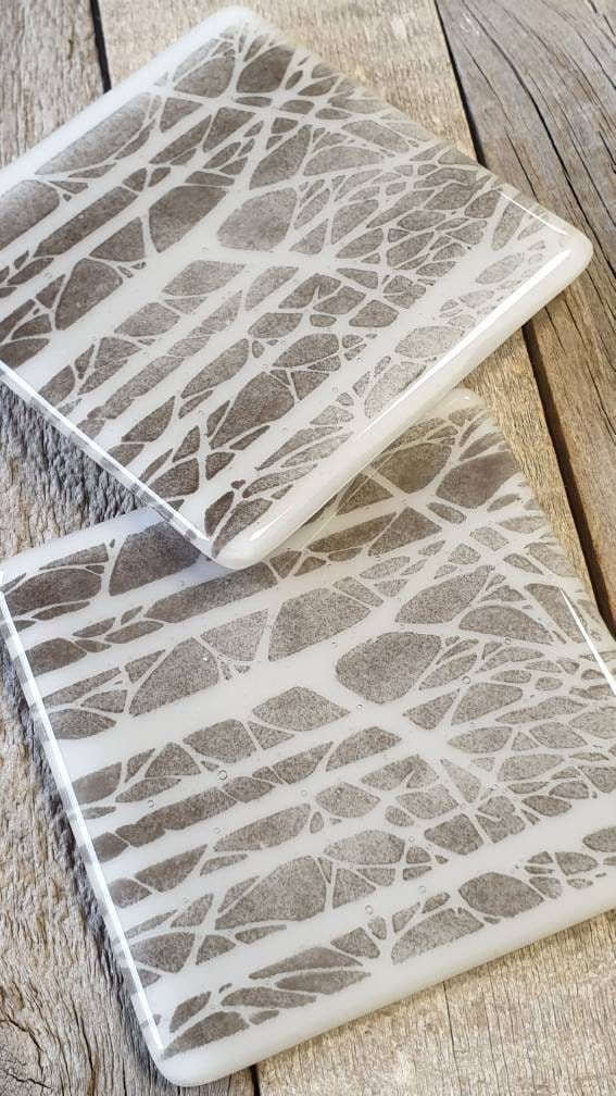 Wonderful forest silhouette fused glass coasters. Each made from clear, white glass and black glass powder. Fused together in the kiln.🌲 

#handmade #shopindie #christmasgifts

samphireglass.etsy.com/listing/1038...