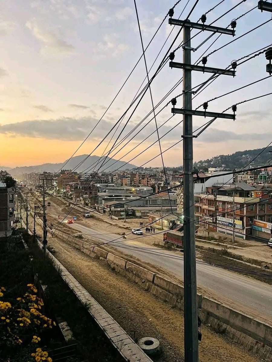 सुर्यविनायक-धुलिखेल सडकखण्ड बनेपा तरकारी बजार देखि बुडोल खण्ड सडक होचो भागमा उठाईदै र साईडको वाल पक्कि गर्दै ।