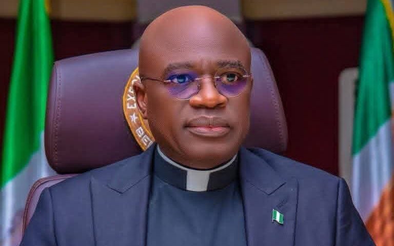 AdoyiA's tweet photo. @HyacinthAlia 
Your statement, that “We do not have any jihad in Nigeria,” is not merely a misrepresentation of fact; it is a profound and grotesque betrayal of the people you swore to protect and a desecration of the clerical collar you so readily invoke. To speak such falsehoods from the dual platforms of governance and the priesthood is an act of staggering moral cowardice that demands a swift and unequivocal condemnation.

Your assertion that you would be the "first to make a noise" is an insult to the memory of the thousands of Benue citizens who have been slaughtered, their homes burned, and their ancestral lands forcibly occupied. The "noise," Your Excellency, has been the cries of the bereaved and the crackle of burning villages, a cacophony of agony that you have chosen to dismiss with a wave of your hand.

Let us speak plainly of the "jihad" you so blithely deny. It may not arrive under a single, official banner, but its features are unmistakable to anyone with the courage to look:

1. The Ideology of Conquest: The attacks by Fulani militant herdsmen are not simple conflicts over resources. They are characterized by a clear pattern of ethno-religious expansionism. The weapon is not merely the AK-47, but a supremacist ideology that views non-Muslim, non-Fulani communities as legitimate targets for subjugation. The demand for "grazing routes" and "grazing reserves" is a political euphemism for the formalized seizure of ancestral lands belonging to the Tiv, Idoma, and Igede people.
2. The Strategy of Massacre and Occupation: The evidence is written in the blood of Benue's soil. Recall the Agatu massacre, where communities were razed and hundreds were killed. Remember the Guma and Logo attacks on New Year's Day 2018, which left 73 dead in a single, the Yelwata massacre which left over 200 precious souls wasted in a coordinated assault. The pattern is consistent: a savage attack to terrorize and displace the indigenous population, followed by the occupation of the now-empty lands by Fulani herders. To call this anything other than a form of settler-colonial jihad is an exercise in semantic dishonesty.
3. The Silence of Complicity: Your denial, Governor, is a carbon copy of the dangerous rhetoric peddled by the highest echelons of federal power, your "paid masters," as many rightly suspect. By echoing this line, you have exposed yourself not as a shepherd to your flock, but as a hired mouthpiece for an agenda that seeks to downplay a genocide in the making. You have chosen to stand with the architects of a forced demographic change rather than with the innocent whose blood soaks the land.

You dare to speak as a "Reverend Father"? Then you of all people should recognize the scent of the wolf among the sheep. The body of Christ is not represented by those who deny the persecution of its members, but by those who stand with the oppressed. Your statement is a scandal to the faith you claim to represent.

The blood of the innocent people of Benue, butchered in Gwer West, Makurdi, Ohimini, Apa and Kwande, cries out from the ground. It is a stain that your carefully crafted words cannot wash away. That blood is now in the hands of every leader who, through action or inaction, enables this carnage to continue. By denying the grim reality faced by your citizens, you have indelibly marked your own.

Your position is a lie. Your representation is a farce. You do not speak for the traumatized and displaced citizens of Benue. You speak for the interests of those who benefit from this chaos. It is a shameful dereliction of duty, both temporal and spiritual. History, and the people of Benue, will not forget this betrayal.

Shame on you.
@MikeArnoldTruth @BOGbadams