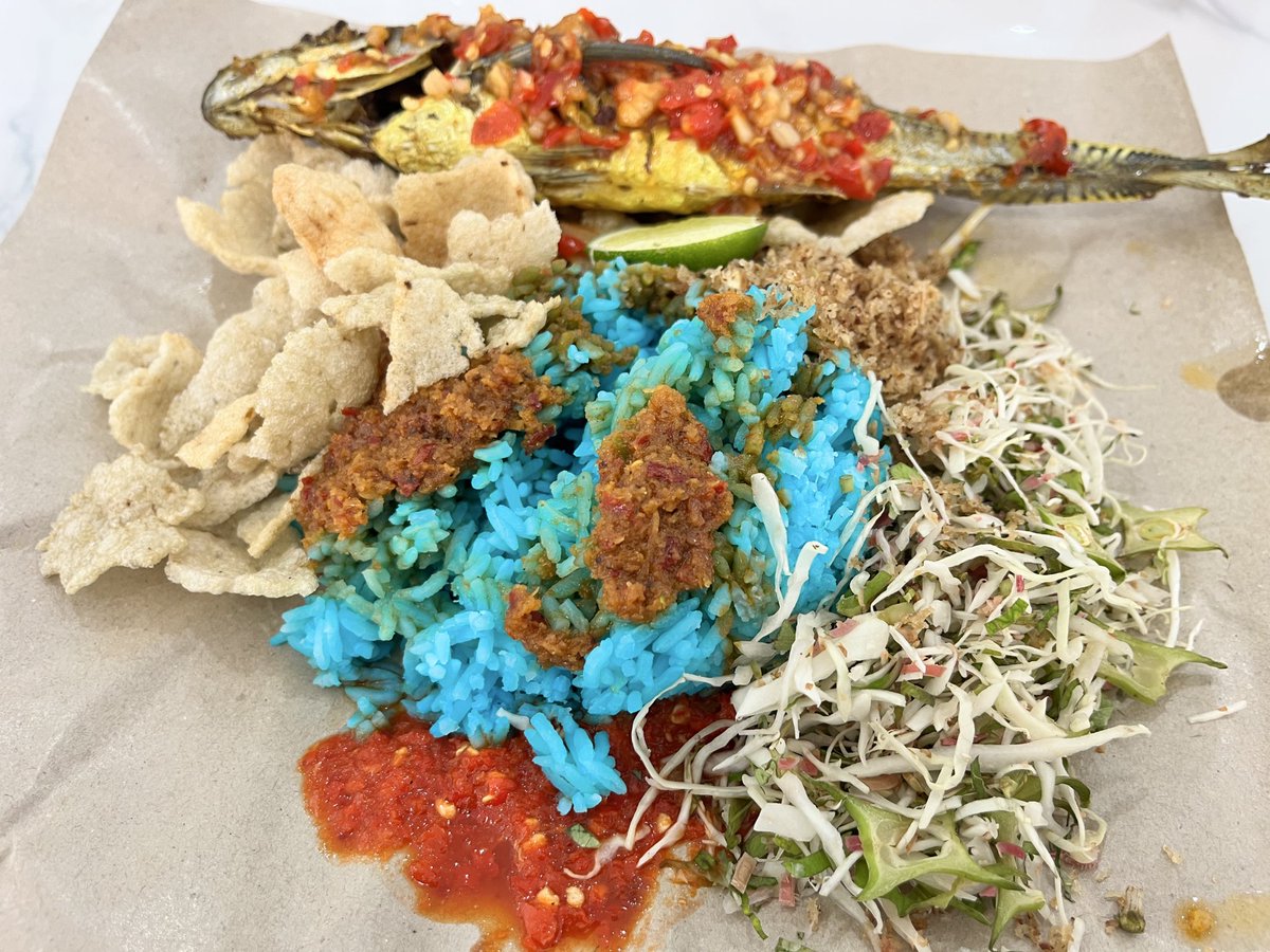 This is Nasi Kerabu, a Malaysian dish from Kelantan. People usually eat it with their hands. But can you eat it with a spoon?
Absolutely.

In Malaysia nobody cares if you use your hands, a spoon, chopsticks. Whatever. Food is meant to connect us not drive us apart.