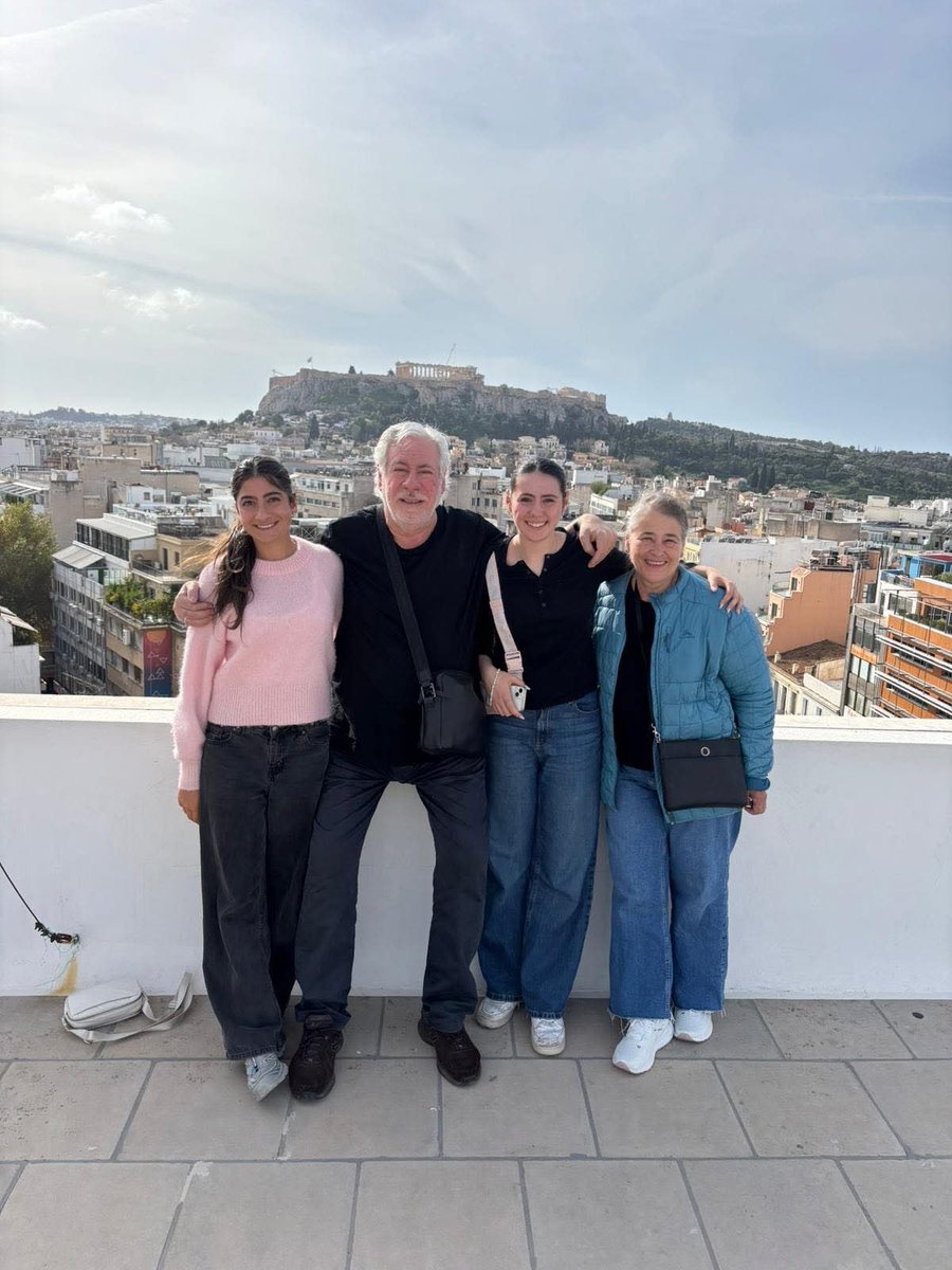 On the roof of Hellenic Ministries Centre Athens with my 3 girls and an awsome view of the Acropolis