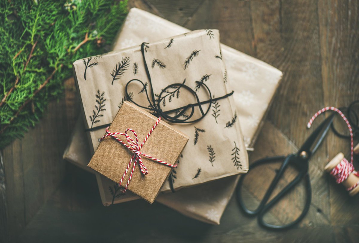 You can wrap Christmas presents using alternatives like fabric, reusable bags, or newspaper and brown paper. Other methods include layering papers, adding natural elements, or decorating with photos, or homemade pom-poms. You can also try tape-free wrapping techniques.