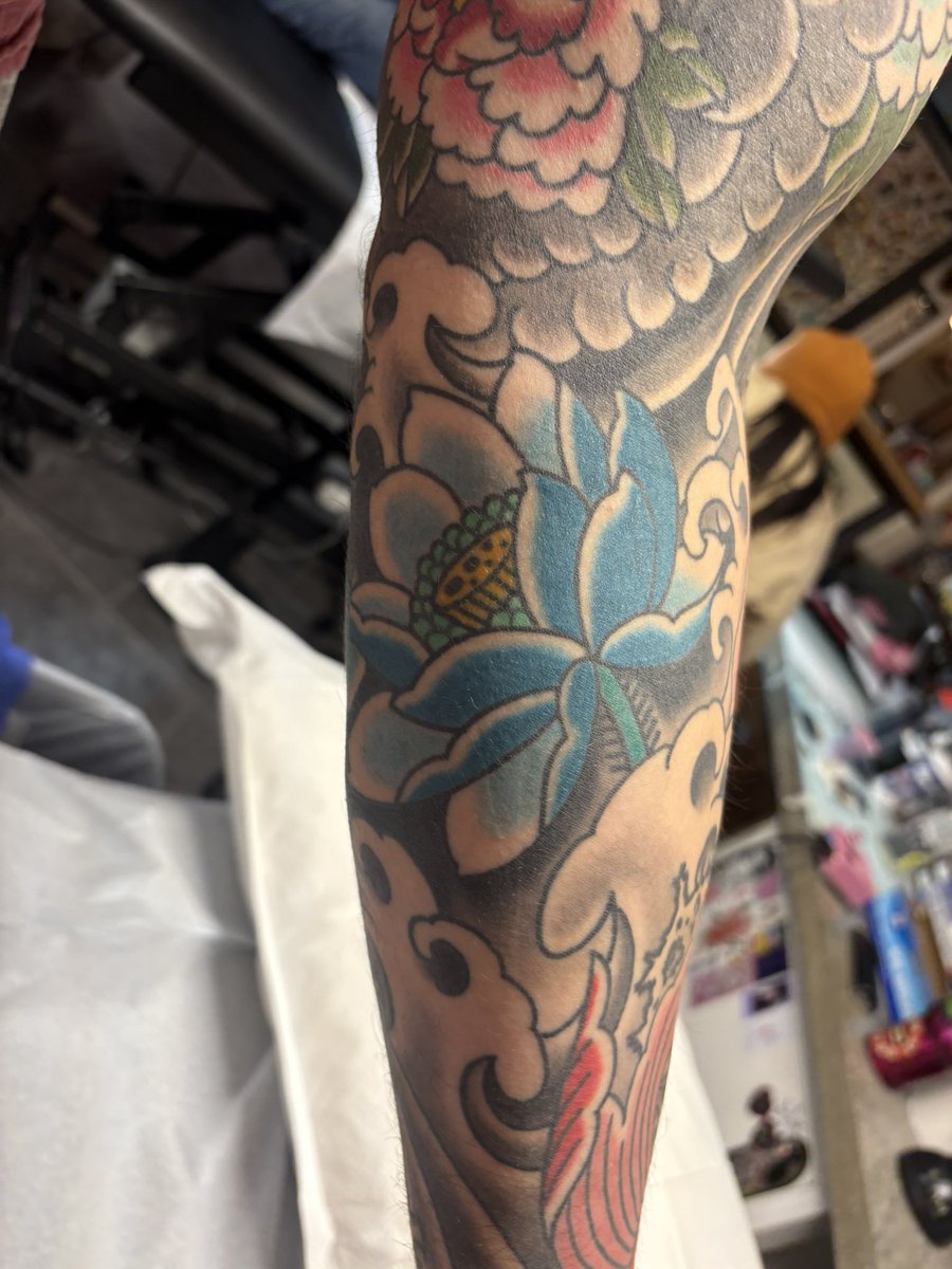 Part of a healed Japanese sleeve with a healed drawn on lotus.