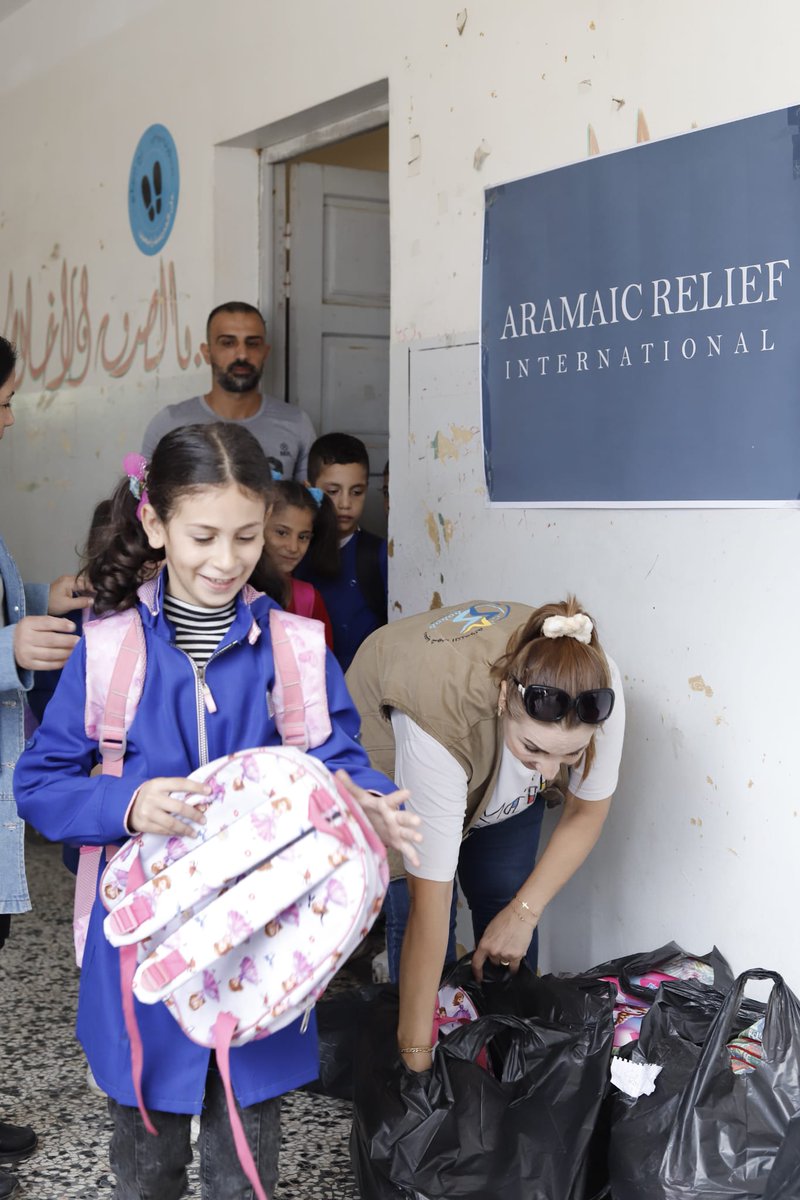 AramaicRelief's tweet photo. In the village of Ain al-Zubda, Tartous 211 children received new backpacks filled with essential school supplies lifting a burden from families and helping kids return to school with confidence and joy.

Let’s keep this hope alive.

👉 Support a child’s education today.

#syria