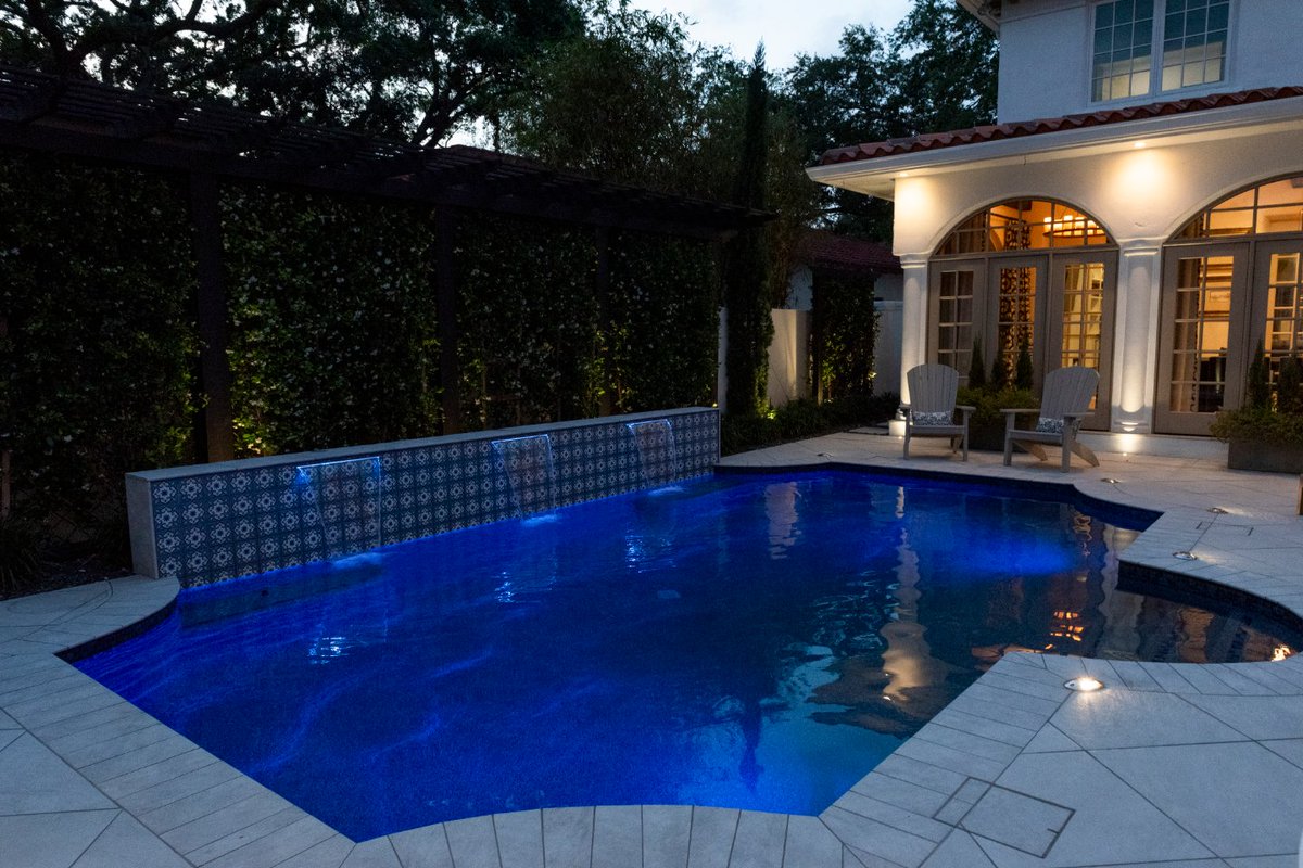 Is this Italy?! Not quite, but Landscape-Fusion brought the next best thing to this backyard. Waterfalls, beautiful landscaping, and a serene pool provide cozy, Tuscan vibes all year around.