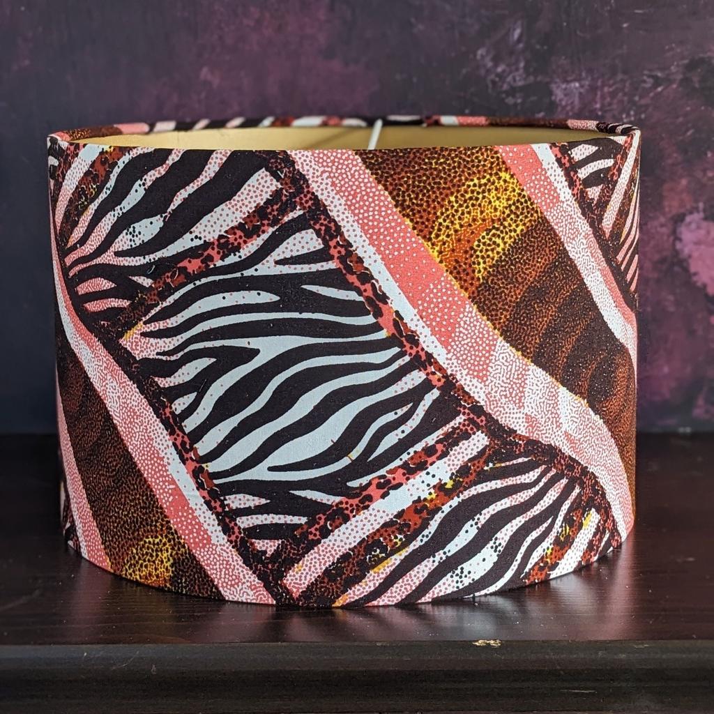 This African safari lampshade's pattern is warm &amp; bold. Can be used with a table lamp/hung from the ceiling. 
detolaandgeek.etsy.com/listing/168542… 

#safari #africansafari #safarilampshade #wildafrica #wildinteriors #detolaandgeek #zebralampshade #tigerlampshade #etsygifts #etsyfinds #etsy