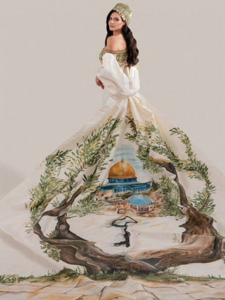 Everyone Saw the Dress. 
Almost No One Saw The-Key.

The only part of Miss Palestine’s dress we should be talking about is the Key under the Dome. That Key isn’t decoration. It’s the symbol of the Right of Return.

Instead, people are arguing about where she lives, who appointed