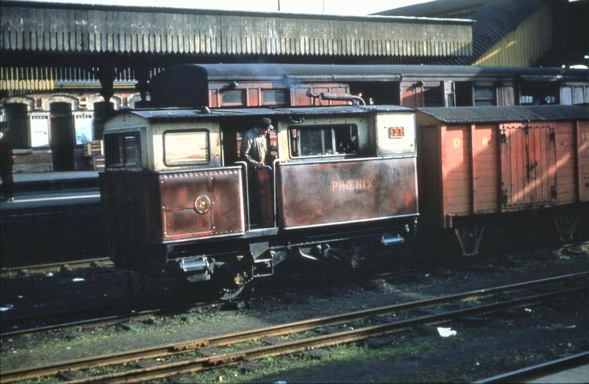 Proving its worth, CDRJC No. 11 Phœnix busies itself with the broad gauge mail at Strabane in 1953. Meeting with the GNRI &amp; stuck between not one but two border crossings, Phœnix's duties ranged from shuttling goods wagon held back by customs to working the exchange sidings.