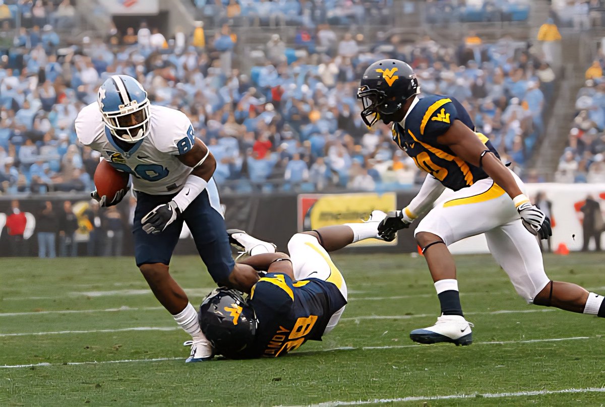uncsportsphotos's tweet image. Carolina Great Hakeem Nicks breaks a tackle against West Virginia in the 2008 Meineke Car Care Bowl in Charlotte.  #UNCFootball #Kenan #UNCommon #unc #ChapelHill #tarheels #GoHeels #ACC #ChapelBill #CarolinaFamily #CarolinaBlue #Carolina #CarolinaFootball #GDTBATH PHOTO COURTESY…