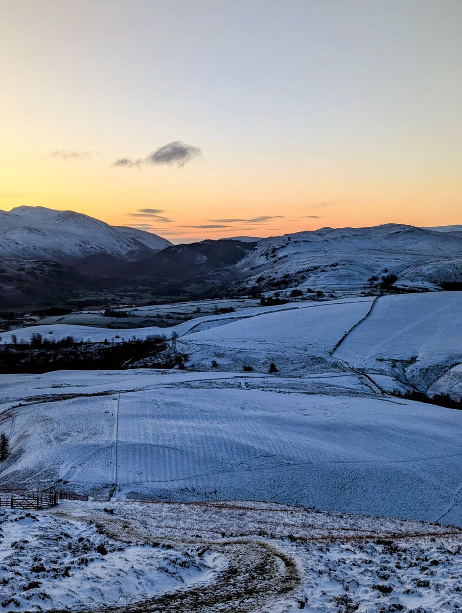 An early start for a solo ascent of Skiddaw,  Little Man.

 Bitterly cold and windy — but absolutely worth it for that sunrise. The soft pink glow over the 10in10 route felt truly magical. 
10in10.org.uk
#10in10view #10in10training #LakeDistrict #snowday #sunrise