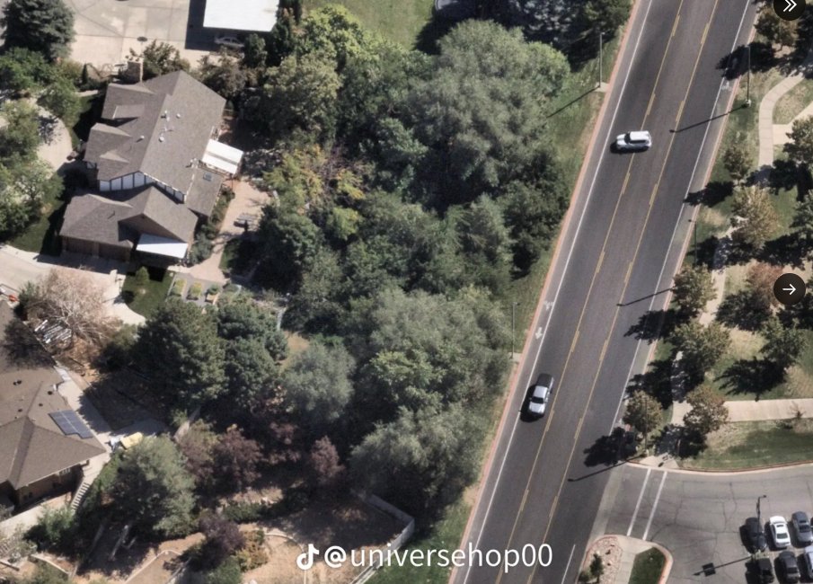 This pic was taken in the hour or so before the Charlie Kirk incident at Utah Valley University.  Their are no driveways near where the car is positioned.  It is noteworthy that the .30-06 rifle was found in the trees directly where the SUV is pointed. 

What is this SUV doing?