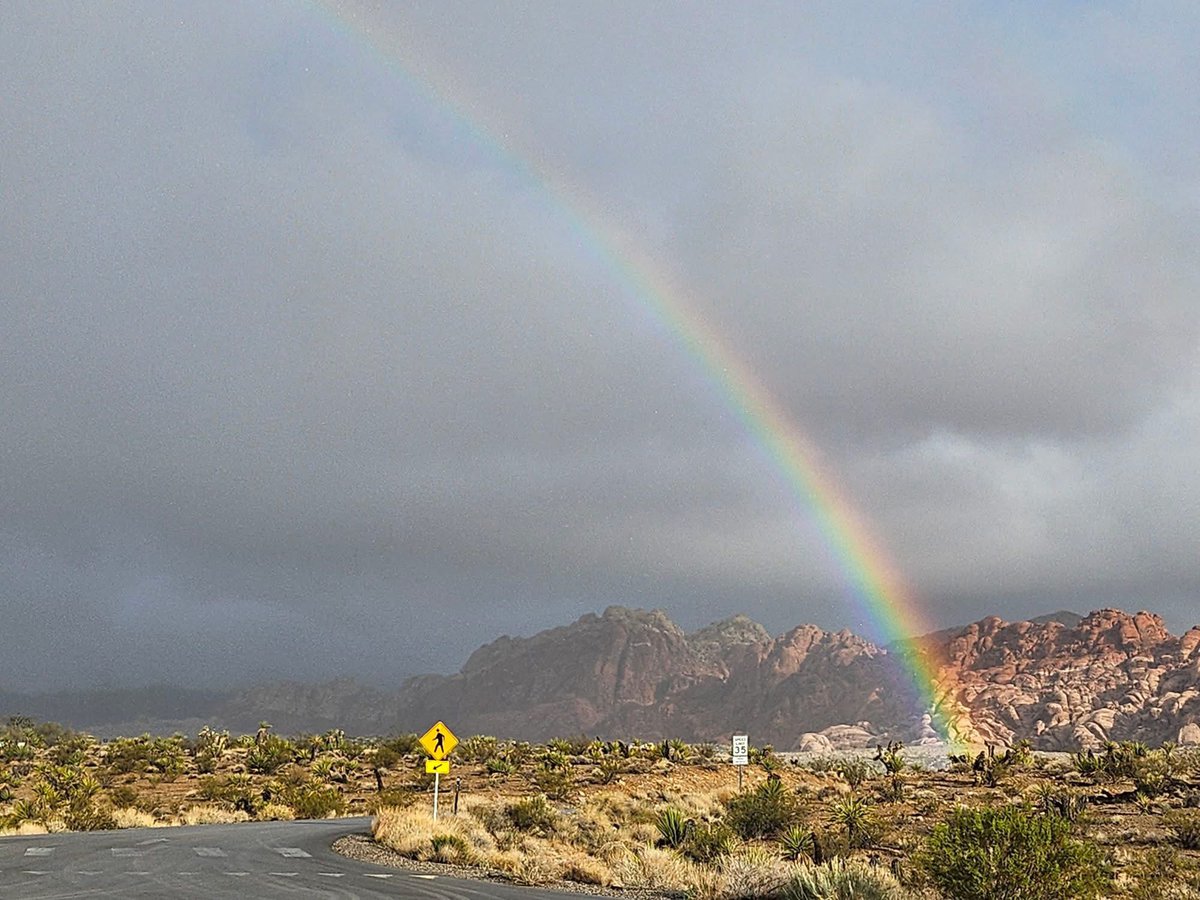 The views this week in Red Rock Canyon have been spectacular!  Is there gold in "them there hills?"  Rainbow intersects the ground in Calico Basin Thursday.  Photo from Carol Tidd.