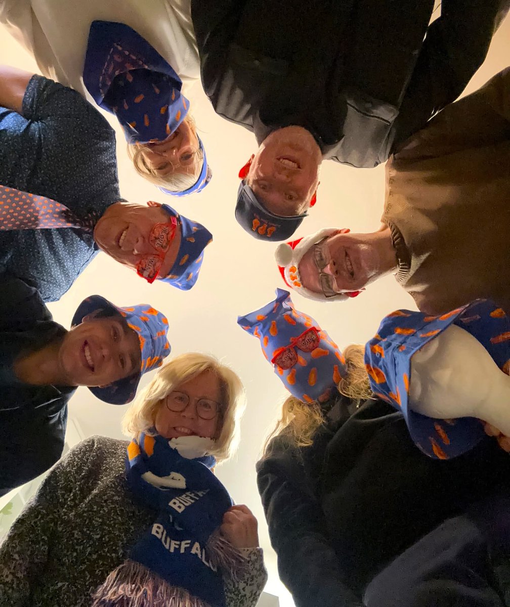 This huddle picture says it all ~ from wing hats and scarves to neckties and “I LOVE WINGS” party glasses, everyone’s repping their favorite flavor of fun. Original Buffalo wing wear gear bringing the heat 🔥🍗🥰