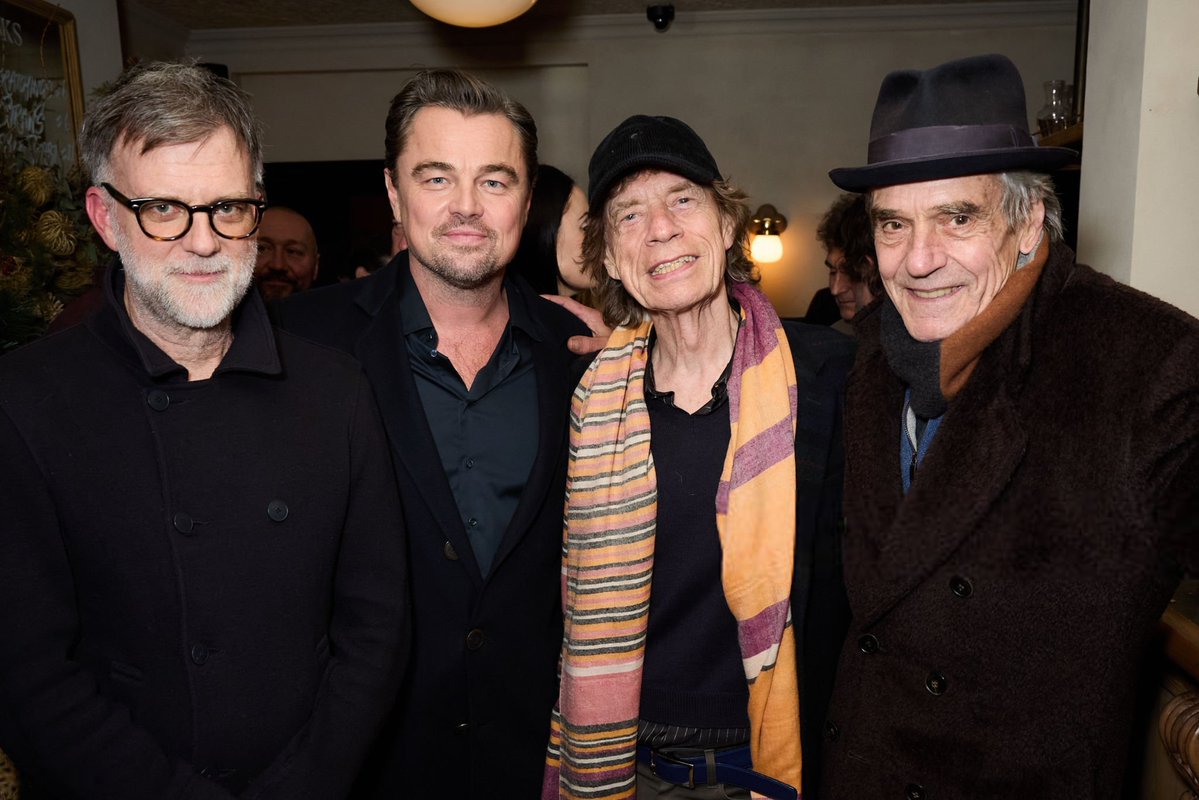 Leonardo DiCaprio with Paul Thomas Anderson, Mick Jagger and Jeremy Irons  during a party to celebrate 'One Battle After Another' at The Hart in  London last night.
