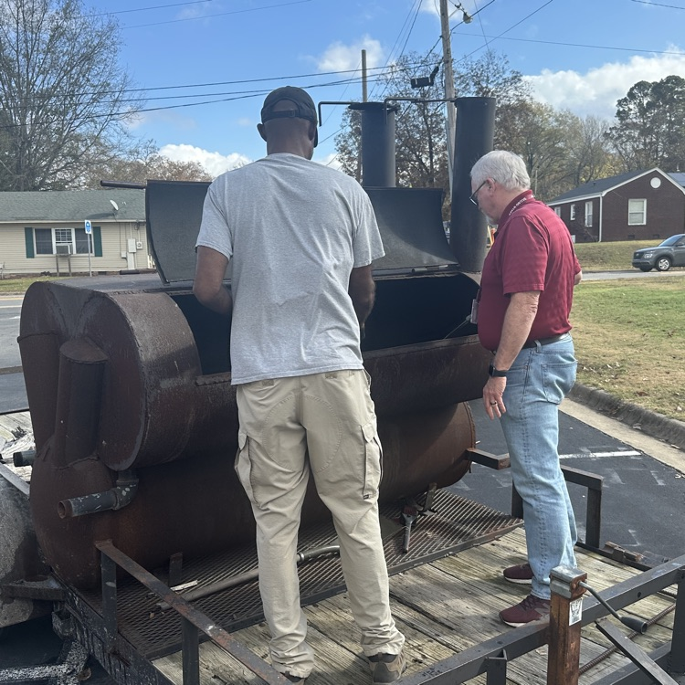 Director of Student Services, Ken Holmes, and South Conway County School District board member Brian Toneygay, cooking hamburgers for the MES staff as part of our celebration for being a B school district as designated by the Arkansas Department of Education.
