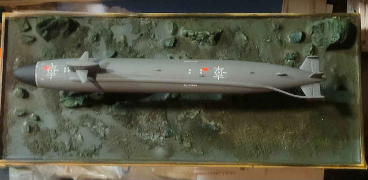 I got up early this morning, poured a set of castings and sprayed Dullcote on the boat, base and wreck.  SSN-665 is on a northerly heading, in the Sakhalin (La Perouse) strait, running relatively shallow, so a minutia of marine life might grow on the southern faces of the "rock