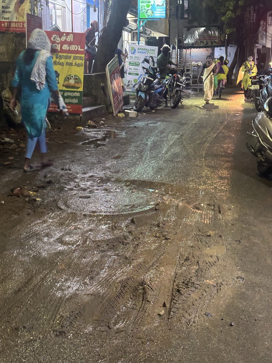bienensting's tweet photo. @chennaicorp Thank you for clearing the debris. But the potholes near the drainage seem to have been filled with the same debris soil, and after the rain, the road has become muddy and slippery. Bikes are skidding and it’s unsafe to walk. This requires proper resurfacing, not loose soil. https://t.co/O0IdhI2DfB