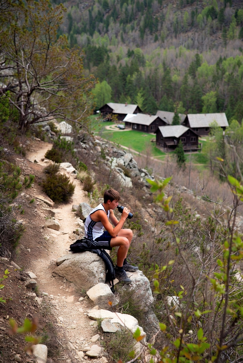 The first sentence I wrote today (CHANGERS), illustrated by @Grok: Nick sat, panting, on a boulder at a turn in the trail that led up the hillside above the old hunting lodge, taking a swig from his water bottle and looking down at the buildings far below.