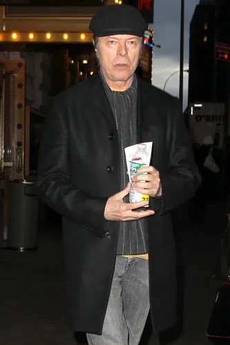 aaronposting's tweet image. Thinking of this photo of David Bowie leaving the Spider-Man musical looking unhappy