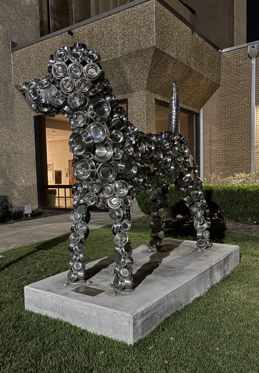 lsuvetmeddean's tweet photo. Leaving work today, it once again struck me how beautiful our campus @LSUVetMed is, accentuated by the light & dark tones of the night. Our Dog Bowl sculpture caught my eye; it seems especially prominent in the hue of the surrounding lights. #LSU #BetteringLives #WeTeach #WBTTW https://t.co/HnG9UVFGPb