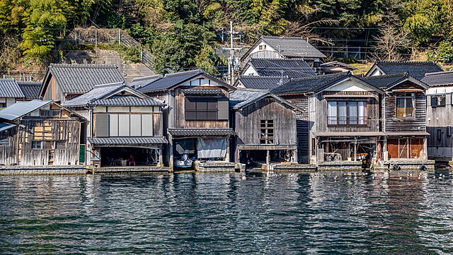 n_hotline_en's tweet image. [Japanese Tourism] Ever stayed in a house with a boat moored beneath your living room? 伊根の舟屋 (Ine no Funaya): traditional boathouses, misty mornings and fishermen&apos;s rhythms. A village paused in time. Follow for more