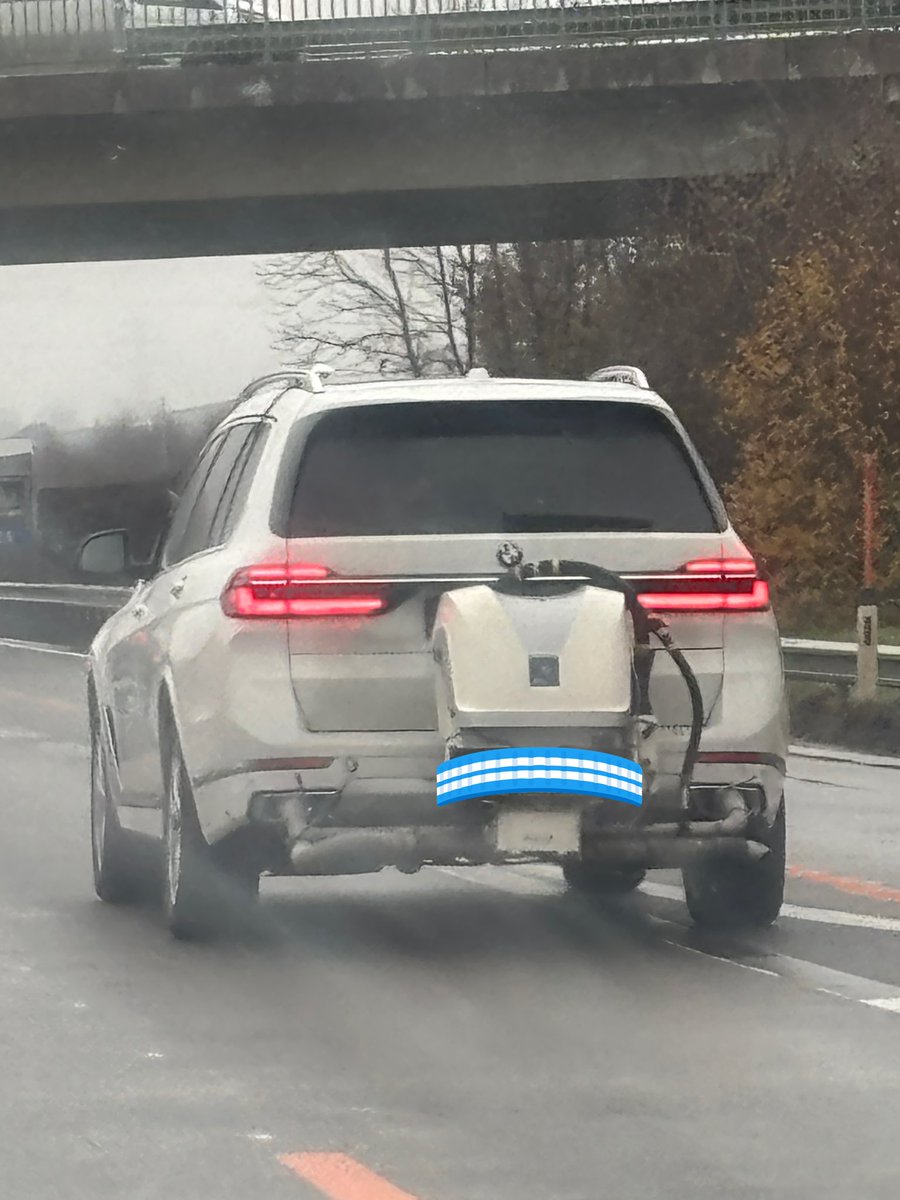 Just saw this on the Autobahn. What is this guy doing?