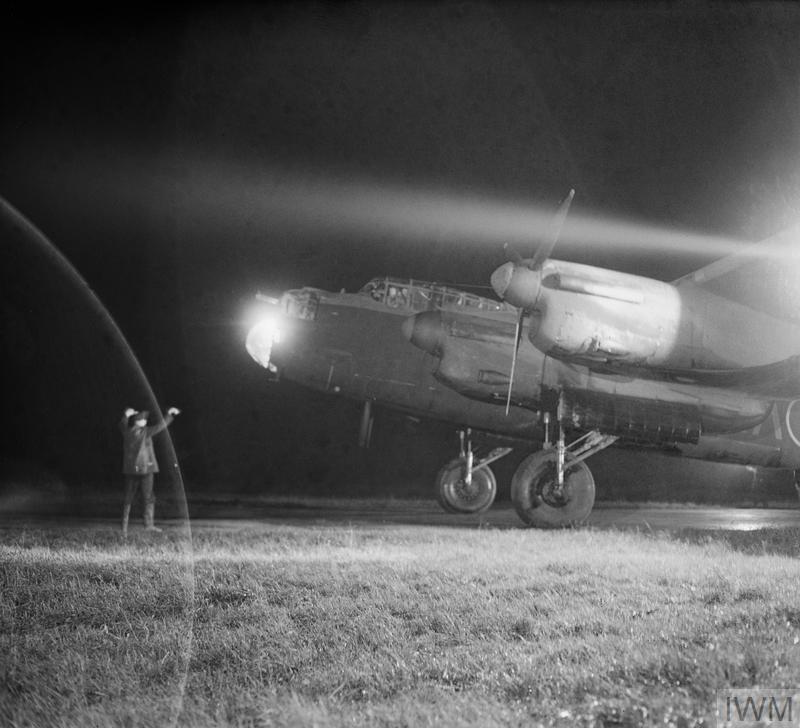 An Avro Lancaster Mk III of No. 49 Squadron RAF is guided to its dispersal point at Fiskerton, Lincolnshire, after returning from a raid on Berlin, 22 November 1943.

Image: IWM (CH 11642)