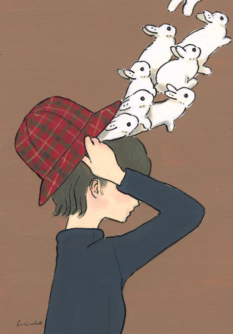 帽子からうさぎを取り出す