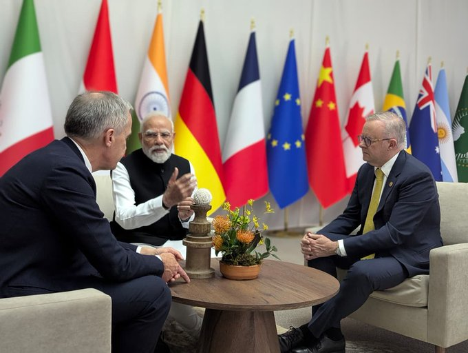 fact_checker_96's tweet image. Here's a picture of Australia and Canada agreeing to become India's population pressure relief valve.