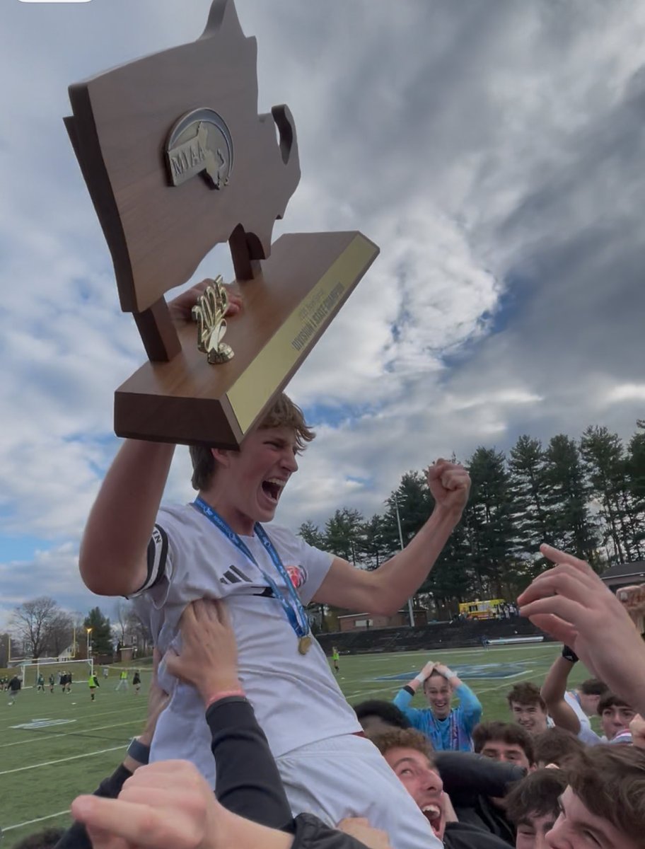 Luke Dougherty with the trophy for Natick. <a href="/NatickAthletics/">Tim Collins</a> <a href="/NHSBoysSoccer4/">Natick HS Boys Soccer</a>