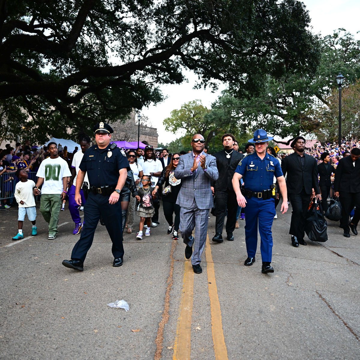 LSUfootball's tweet photo. Tiger walk with our coaches' families https://t.co/8EntXABw2p