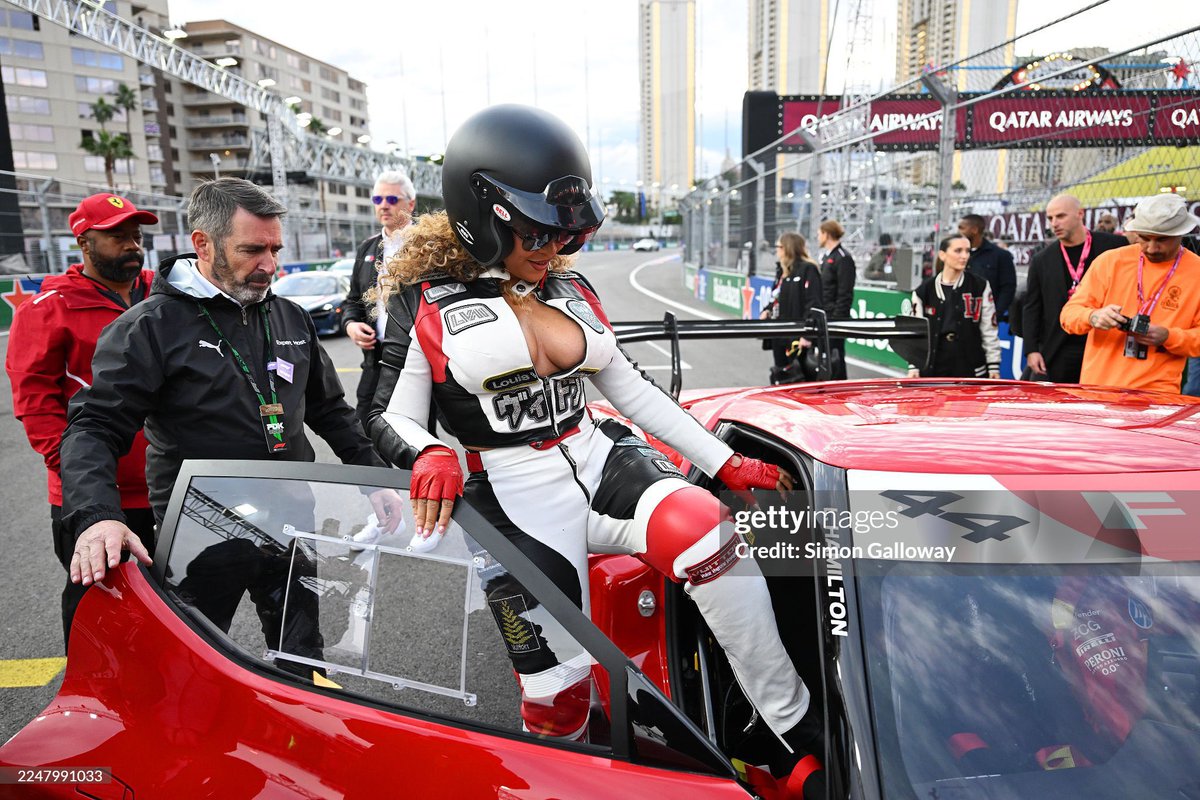 BeyLegion's tweet image. Beyoncé climbs aboard with Lewis Hamilton for a hot lap around the F1 circuit in Las Vegas. 🏎️
