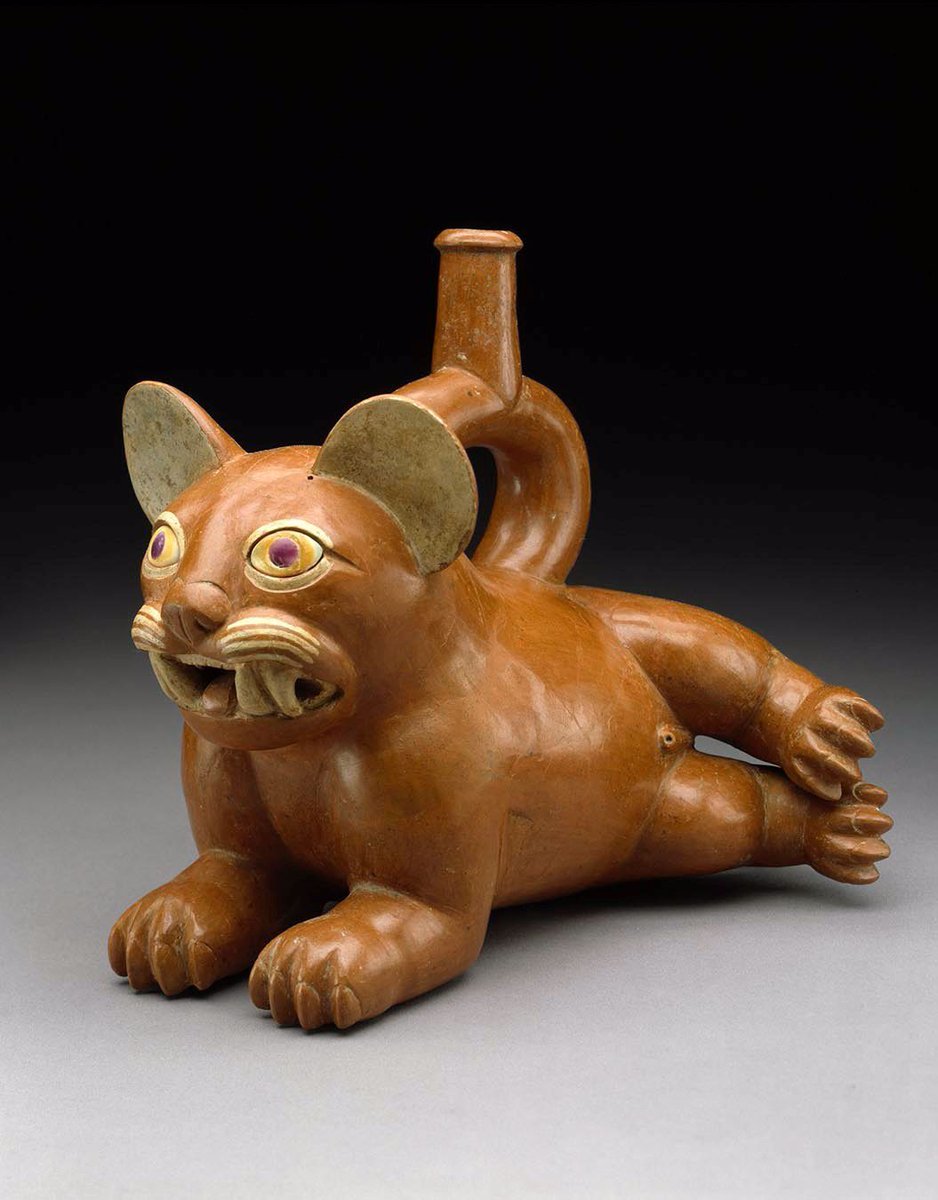 Reclining Feline Vessel. Culture: Moche. Place: Peru. Date: 100–300 AD. Medium: Earthenware with slip. Dimensions: 19.1 × 21.9 × 14.3 cm. Collection: The Museum of Fine Arts, Houston.⁣
⁣
While the stylized feline is eye catching, the real genius here lies in the peculiar handle