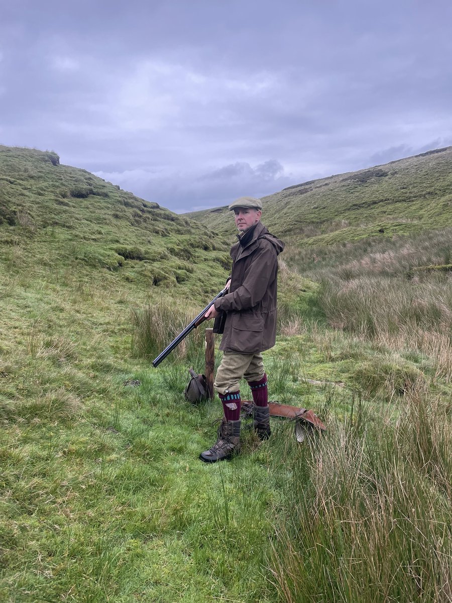 It is not illegal to own a shotgun in the UK, or to post a picture of yourself with one.