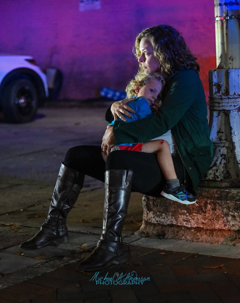 mattvanswol's tweet image. This is a photo of a North Carolina mother holding her toddler after they RAN FOR THEIR LIVES from a shooting at a CHRISTMAS TREE LIGHTING CEREMONY. 

Burn this into your memory, we DO NOT have to live like this.

It has to stop. 

Not tomorrow. RIGHT NOW!!!!