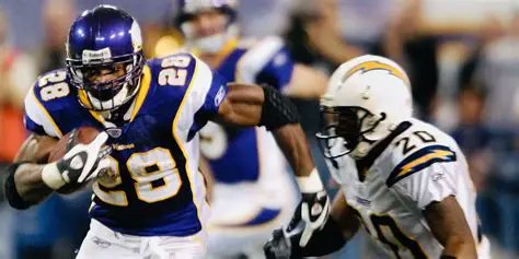 TheWinningWear's tweet photo. Under the stadium lights, Adrian Peterson became unstoppable — 296 yards, countless tackles broken, history written with every step. ⚡🏈 #NFLHistory https://t.co/RLRtYv9hcY