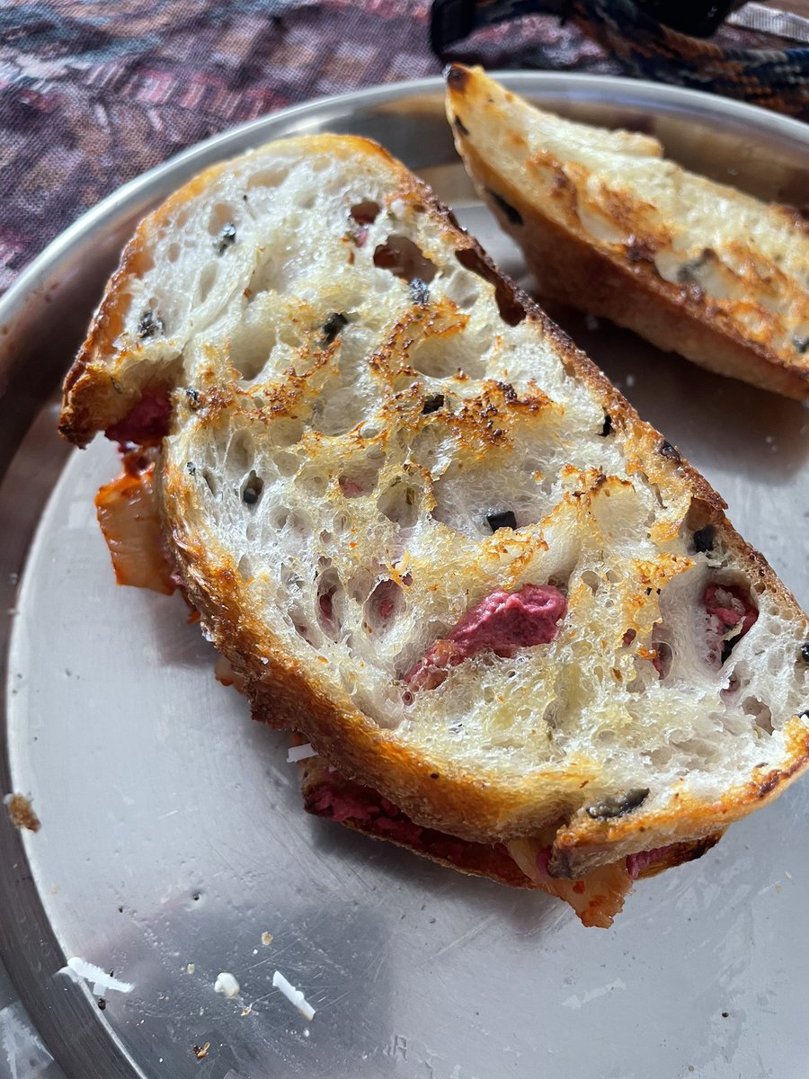 bready_mercury's tweet image. Olive and rosemary sourdough with beetroot hummus, vegan cheese and kimchi.