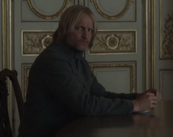 kimichkis's tweet photo. the way haymitch trusted katniss so much that he 'breaks' his promise to lenore dove when he has the opportunity to end the games... i'm going to kms. this scene hits so differently after knowing all he went through. the long pause as they stare at each other.. absolute cinema https://t.co/da9KYZcECC