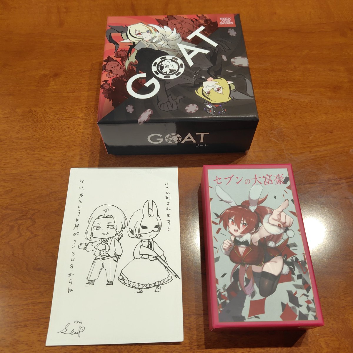 sukesuke_game's tweet photo. ゲムマお疲れ様でした！
今回の戦利品です。どちらもプレイヤーとして以前から推しているサークル様の作品です。そしてシープさんにリクエストして描いてもらった自サークルのドローイング。（笑）

セブンの大富豪
GOAT
#ゲームマーケット2025秋 https://t.co/G0X6PGu6up