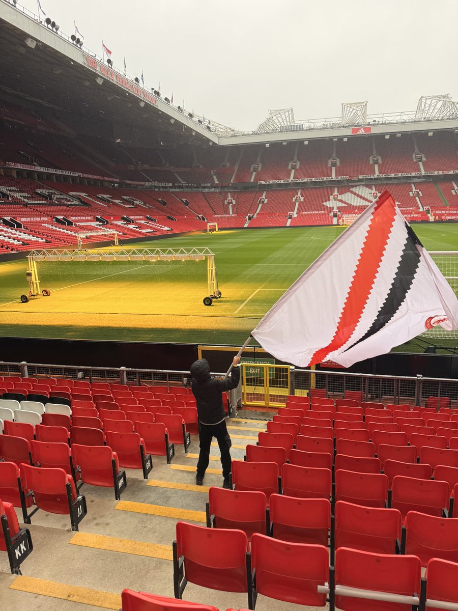 MarcinZelekMUFC's tweet photo. The famous TRA ultras getting  the flags out this morning. Stretford End is ready for tomorrow 😍🇾🇪 https://t.co/2dJM0SaPb6