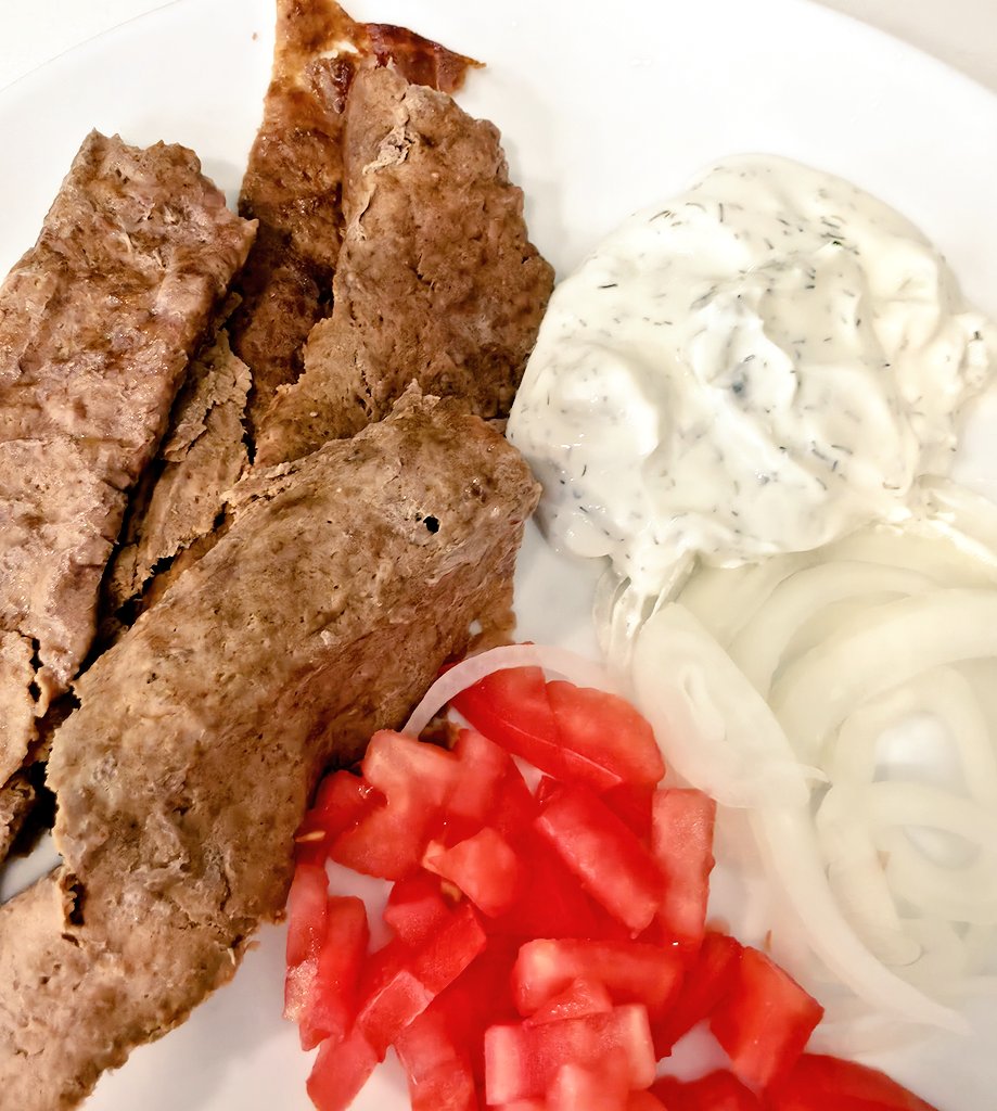 Did you know you could make gyros without a spit? I used ground lamb with spices, flattened between two layers of parchment paper and cooked rolled in the parchment at 400F for 20 Min. Side of onions, tomato, and tzaziki