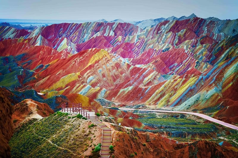 The Rainbow Mountains of China within the Zhangye Danxia Landform Geological Park are a geological wonder of the world. These famous Chinese mountains are known for their otherworldly colors that mimic a rainbow painted over the tops of rolling mountains.