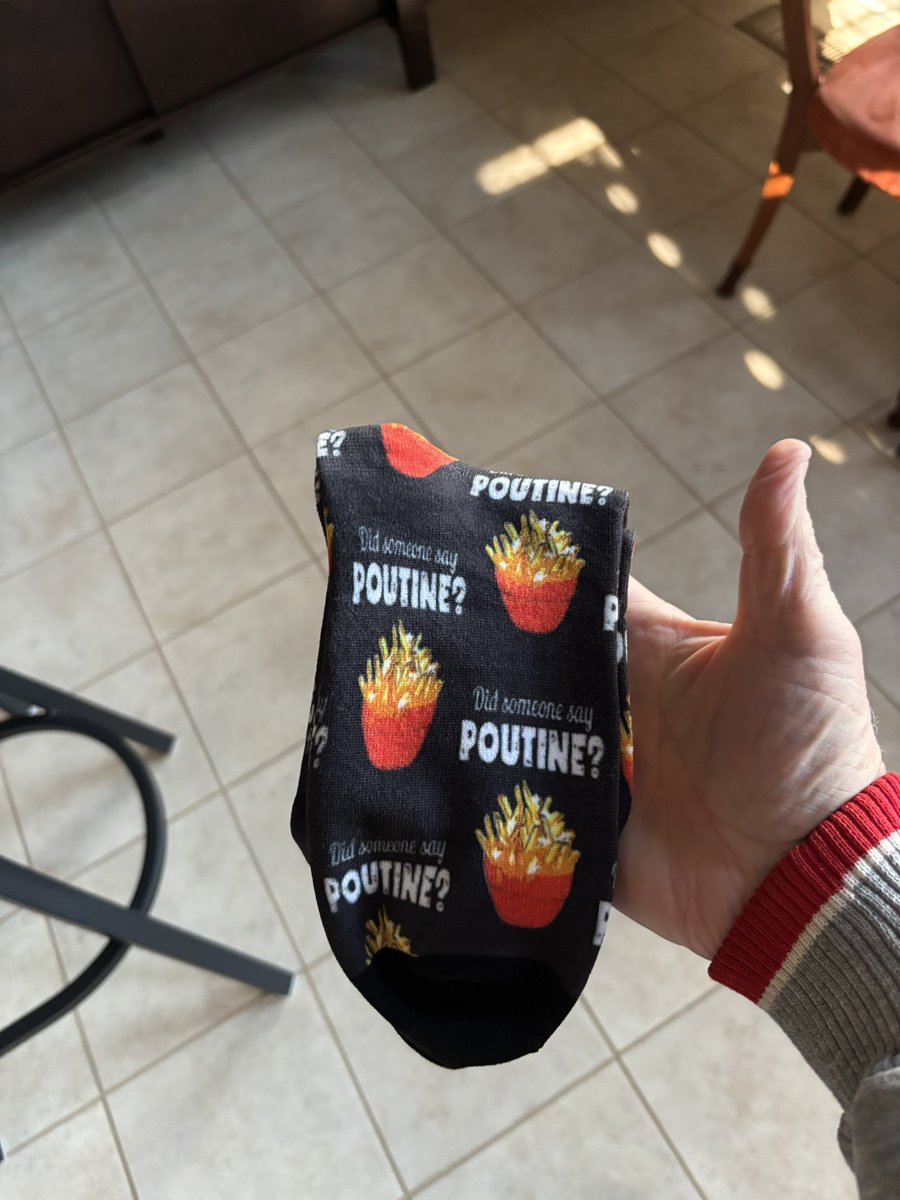 A pair of poutine socks sent by the inimatable <a href="/rolliwrites/">Rolli</a>. I know he didn’t wear them as he is a psychopath! 😬