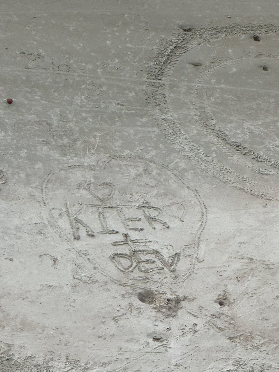 selozrs's tweet image. i drew kier + dev in the sand and someone drew hearts around it #kier #dev #kieranddev