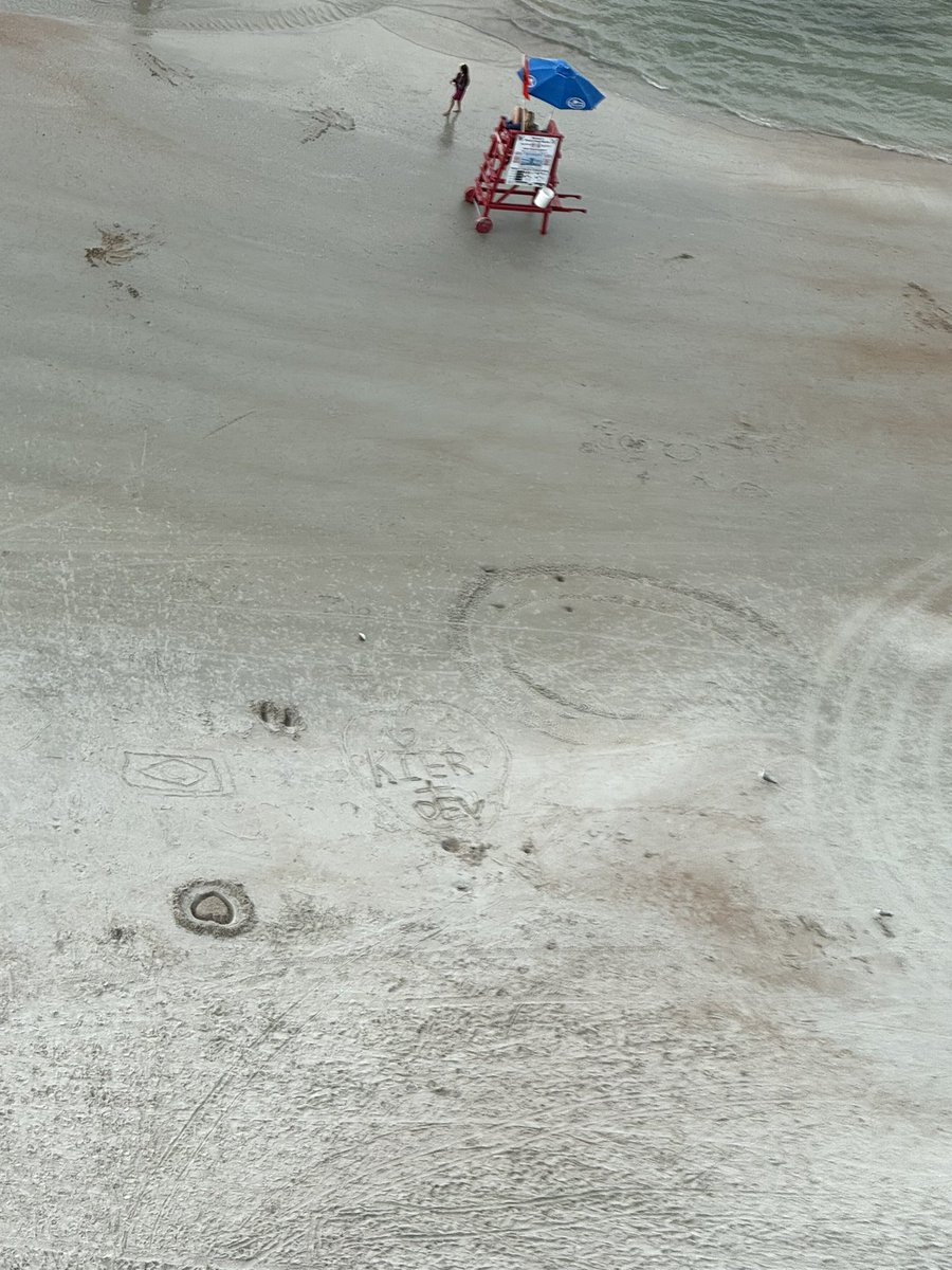 selozrs's tweet image. i drew kier + dev in the sand and someone drew hearts around it #kier #dev #kieranddev