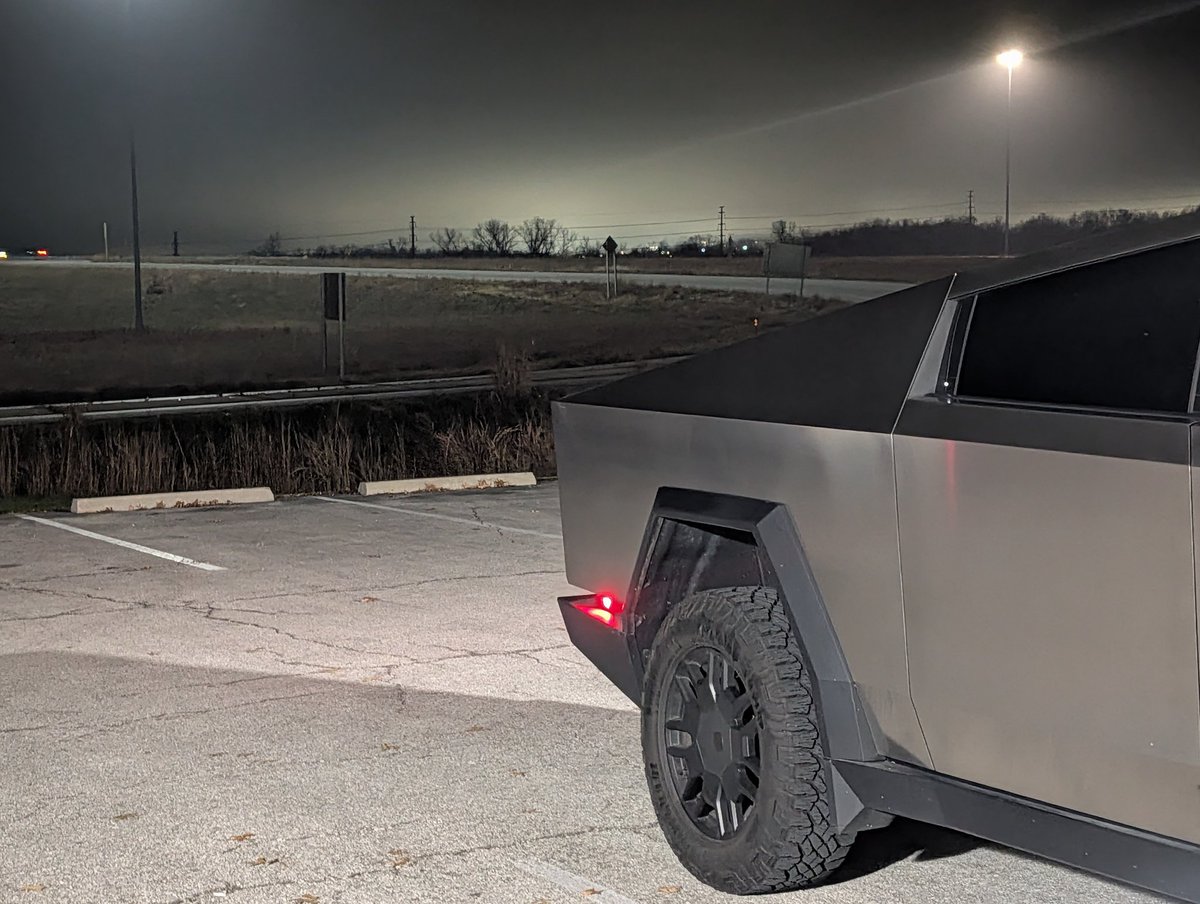 mikegkc's tweet image. Light from the @panasonic plant in DeSoto, Kansas in the background. Doesn&apos;t make the batteries for my robot but makes the batteries for a bunch of  cousins. @cybertruck