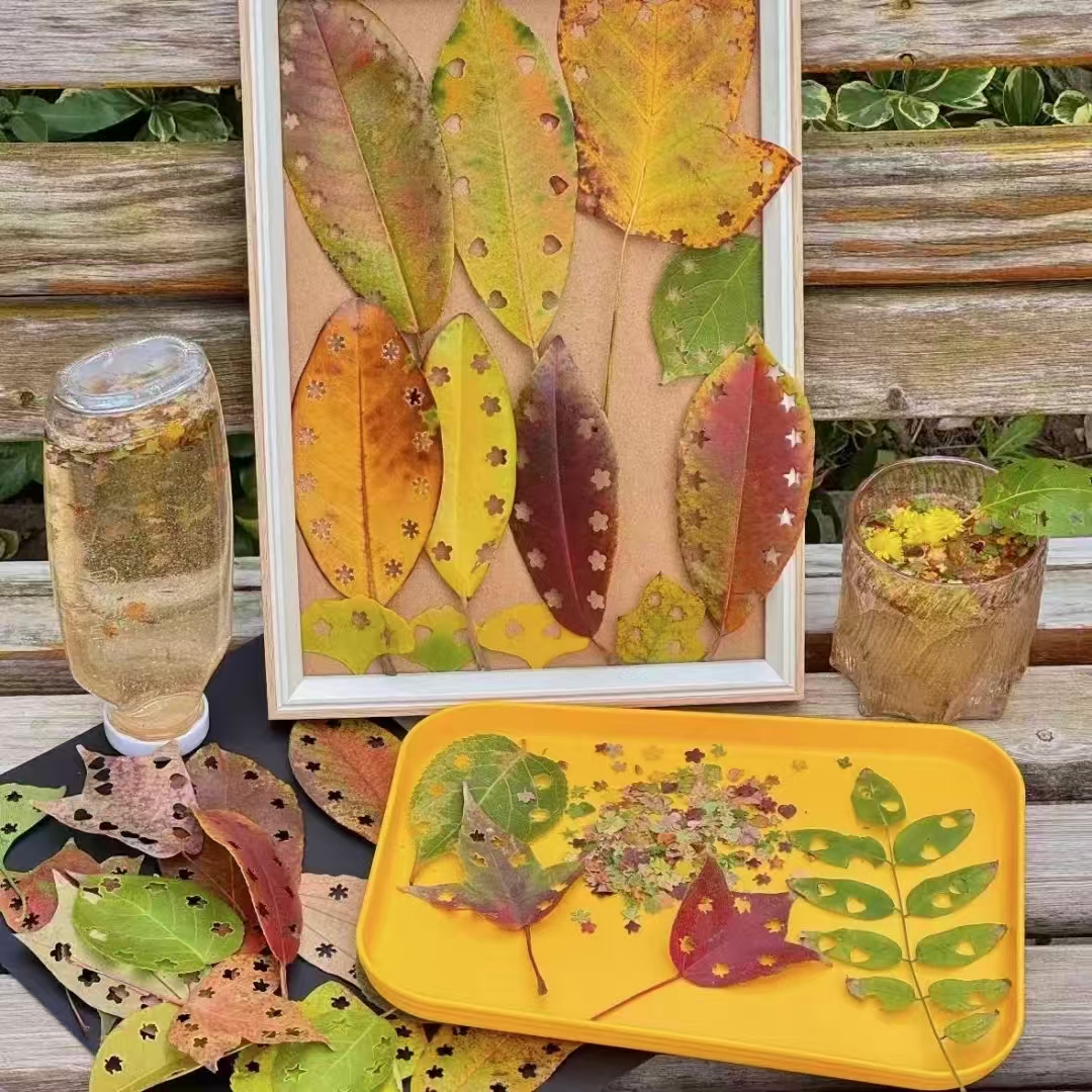 Hi_Deqing's tweet photo. "This year everyone's punching stars and hearts into leaves, so I'm collecting colors to craft tiny autumn jars for my daughter,"says local Ms. Zhou. Across Deqing, families are bottling the season, one leaf at a time. #DeqingAutumn #LeafCraft #FallVibes https://t.co/PVJnL7Rkal